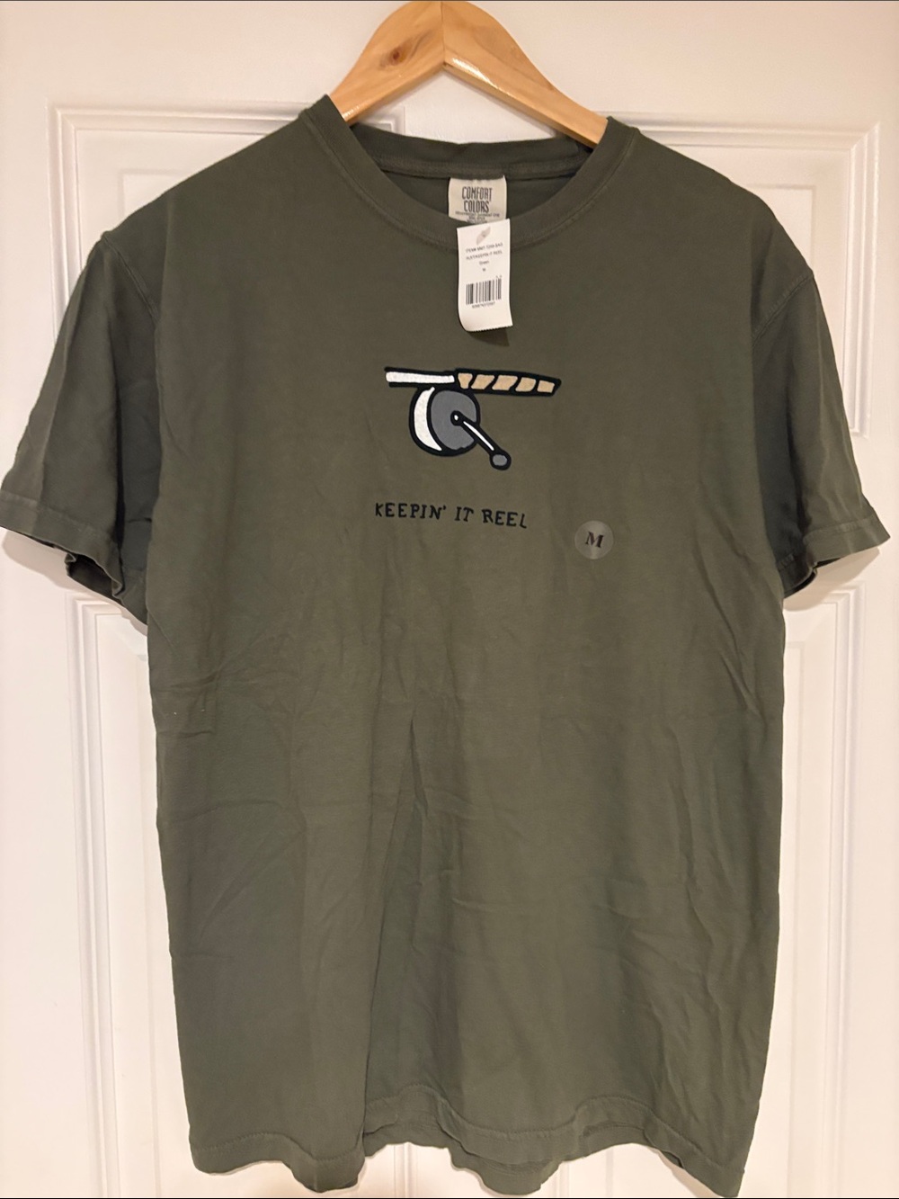 Comfort Colors Olive Green Men’s T‑Shirt with Fishing Reel Graphic